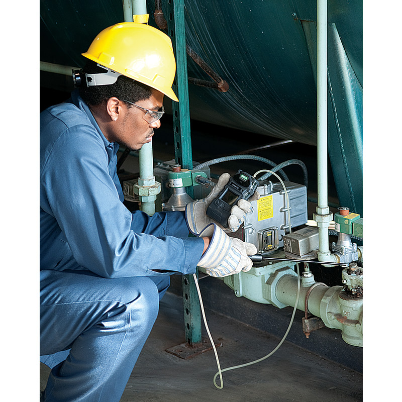 Technician performing gas detector calibration